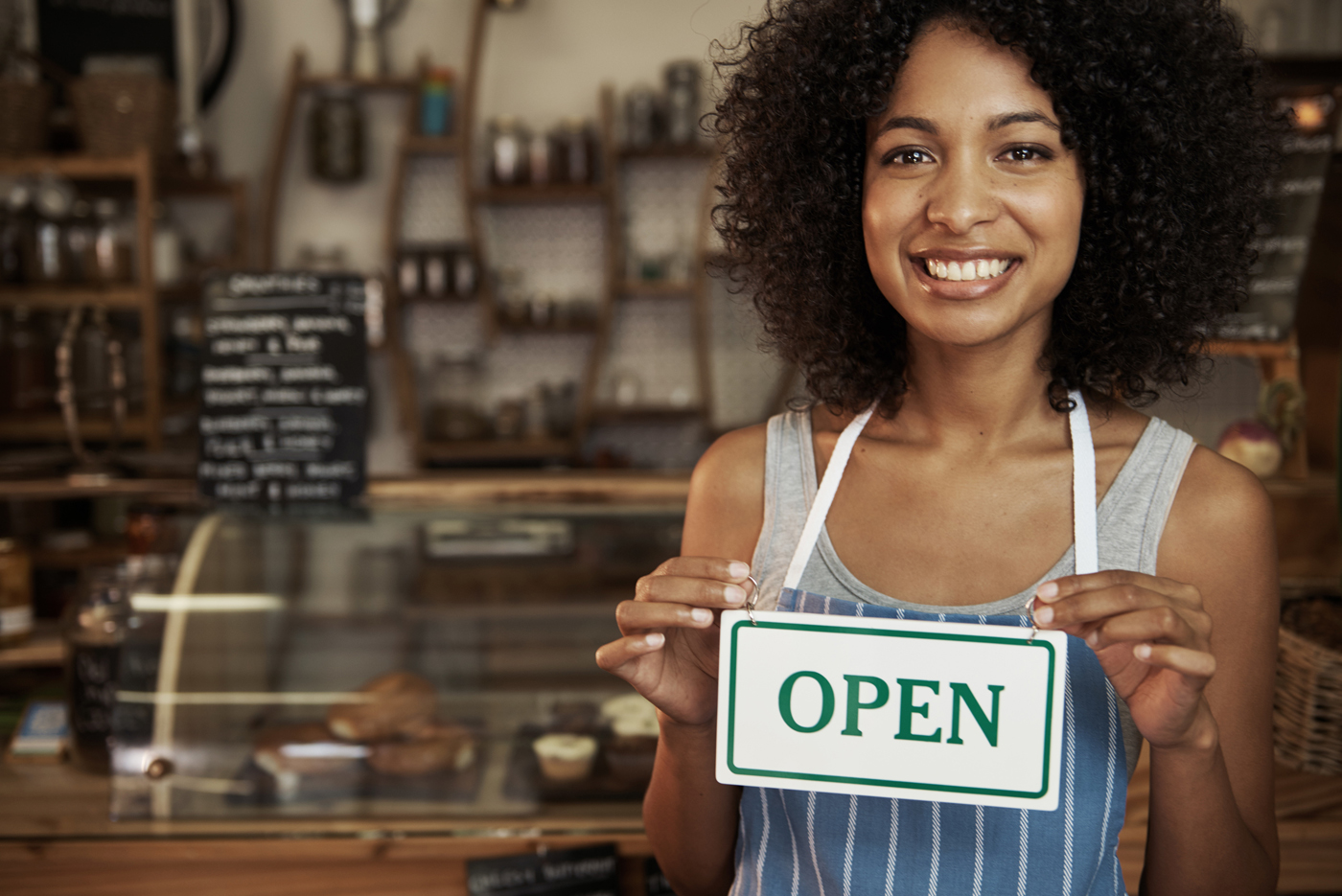 woman-holding-open-sign